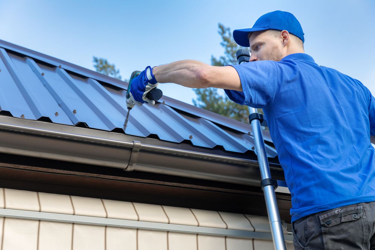 Worker Installing Metal Roof